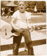 A very young Lindsey playing the guitar